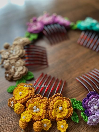 A circular arrangement of our colorful crochet bun combs. This shows the range of colors we offer, from sunny yellow to deep purple, all handcrafted with love.