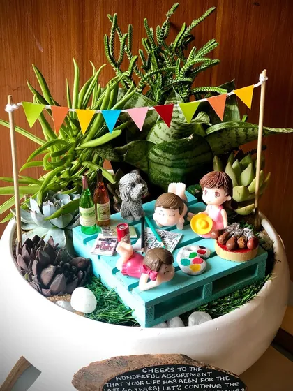 Cheers to 40 years. This garden was for a big birthday celebration and captures a perfect afternoon with friends, painting, wine, and even a little dog. I love getting all the tiny details just right for these personalized gifts.