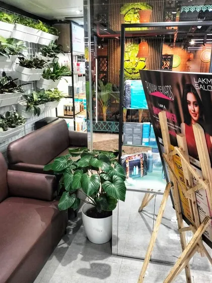 I helped this Lakme Salon create a tranquil oasis for their clients. The combination of a large floor plant and a custom vertical wall garden in the waiting area instantly makes the space feel more relaxing and upscale.