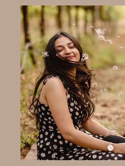 A whimsical, dreamy portrait of the bride-to-be with dandelion seeds floating around her. It’s a magical and feminine shot.