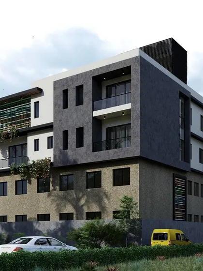 The back facade of the St. Xavier's Kindergarten and residence building. The design maintains a modern and cohesive architectural language, with clean lines and a balanced composition of different materials and finishes.