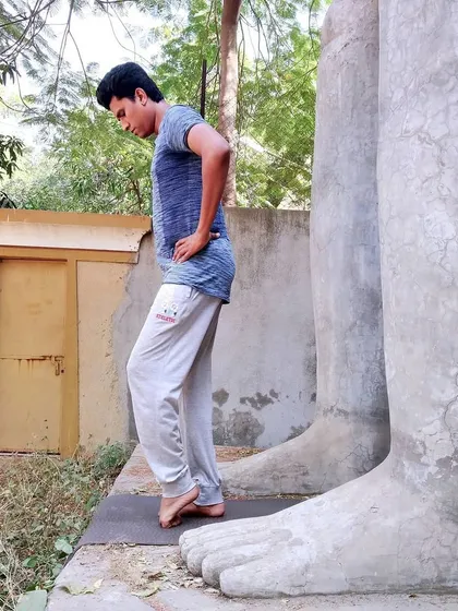 This posture involves balancing on folded toes, a challenging exercise that deeply stretches the plantar fascia and strengthens the small muscles in the feet. It is an important practice for building a resilient foundation.