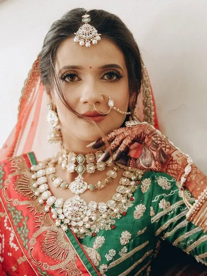 A powerful portrait that highlights the intricate details of the makeup, from the defined brows to the expertly blended foundation and concealer.