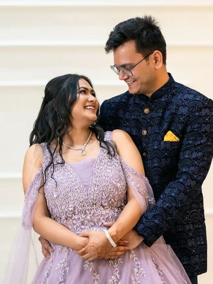 A happy, candid moment between the couple, capturing their natural smiles and interaction.