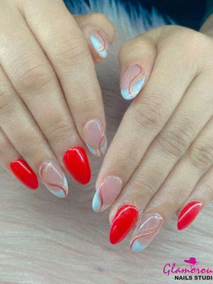 An elegant abstract design pairing bold red nails with sheer accent nails featuring delicate swirls of red, blue, and gold.