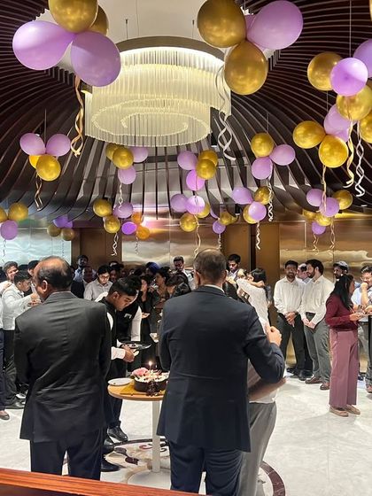 A wide shot of our team celebrating together, highlighting the vibrant culture and collective spirit of our firm.