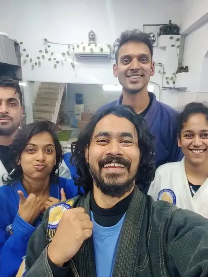 The instructor and students celebrating a successful training session, highlighting the strong student-teacher bond we foster.