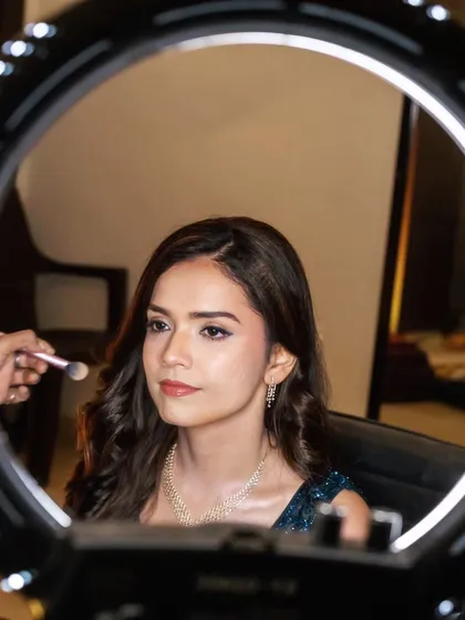 Here’s a little peek behind the scenes. Using professional lighting and the best HD airbrush makeup techniques, I ensure every detail is perfect. This is where the magic happens, creating a look that is flawless both in person and on camera.