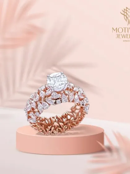A truly magnificent creation. This ring features a prominent cushion-cut solitaire, elevated above a double band of intricately set marquise-cut diamonds, creating a piece of unparalleled brilliance and design.