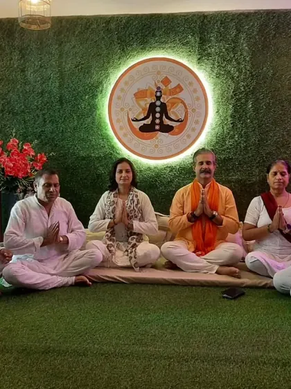 A moment of shared peace and gratitude after a group meditation session. People from all walks of life come together here to heal, forming a beautiful community centered around spiritual growth and well-being.