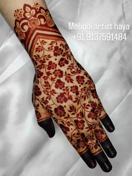 A perfect example of a beautifully developed henna stain. The floral net pattern is crisp and clear, and the color is a rich, dark reddish-brown.