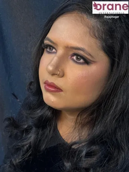 A profile view of the tan glam look, showing the contouring and highlighting on the cheeks.