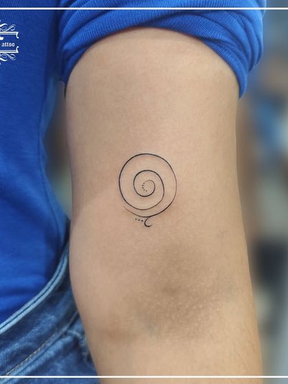A gratitude spiral tattoo, representing an ever-expanding sense of thankfulness. This simple, symbolic design is a beautiful reminder to stay positive.