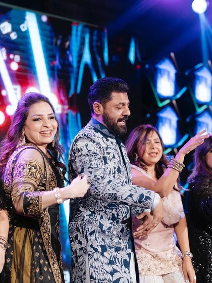 The groom dancing with his family is what Sangeet is all about. We create a fun, inclusive atmosphere that encourages everyone to join the celebration.