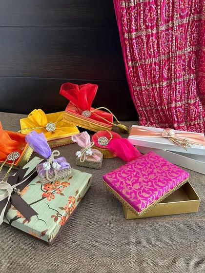 This image showcases a variety of my small gift boxes and potlis, all ready to be curated into a beautiful hamper. The mix of colors and textures provides endless possibilities for customization.