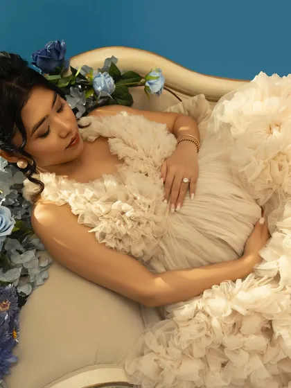 A moment of softness, serenity, and strength. This frame isn't just a picture; it's a feeling of calm before the beautiful storm of love.
