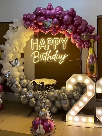Another angle of the 23rd birthday setup, showing the hourglass-shaped table stand.