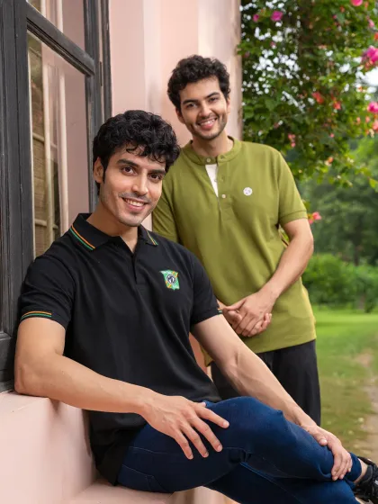 A lifestyle apparel shoot for MG Motor, featuring two models in a relaxed, natural setting. This image captures a friendly, casual moment that aligns with the brand's accessible style.