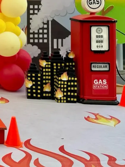 The themed flooring with flame details and miniature burning buildings adds to the immersive setup.
