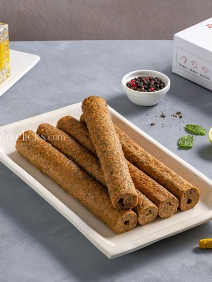 Mutton seekh kebabs from Zappfresh, styled with whole spices and the product packaging.