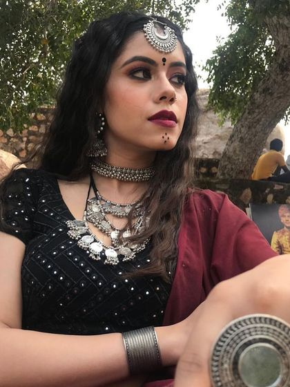Another look at the 'Jogan' styling. The combination of dark makeup, traditional bindis, and heavy silver jewelry was essential in creating the song's intense and spiritual vibe.