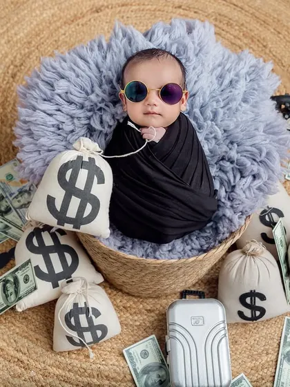 A newborn version of the "Boss Baby" theme. I ensure my tiniest clients are safe, swaddled, and comfortable.