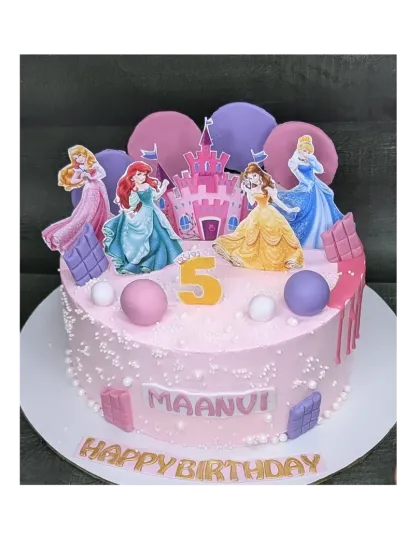 A pink princess castle cake with an eggless choco-chip flavor. This cake is decorated with several Disney princesses, making it a dream come true for any fan.