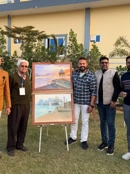 Posing with senior artists and my landscape paintings at the conclusion of the camp.