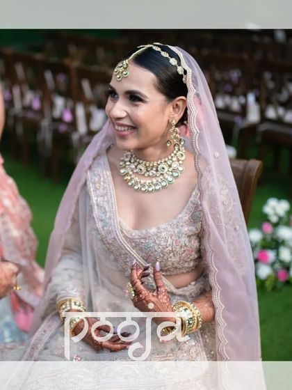 A happy, smiling portrait of the bride during her outdoor wedding ceremony.
