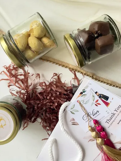 Return hampers prepared for an engagement ceremony. Each gift bag contains jars of our sweet treats and a custom card, making it a memorable token of appreciation for guests.