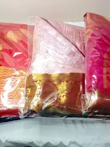 A batch of sarees, all pleated and packed, ready for a client. This is the final step of my service, ensuring your sarees are protected and easy to manage.