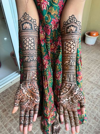 A clear, top-down shot of a full bridal design, featuring a mix of geometric and floral patterns.