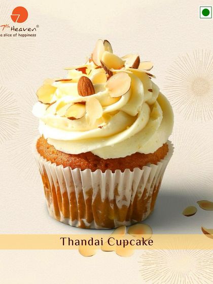 A festive Thandai Cupcake for Holi. This treat infuses the traditional spiced milk flavor into a soft cupcake, topped with frosting and almond slivers.