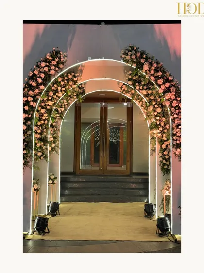 A framed shot of the modern archway, perfect for showcasing a blend of contemporary design and romantic floral styling.