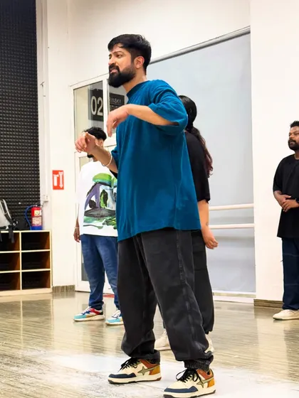 Explaining a specific count and movement to the group. Clarity and patience are key to my teaching method.