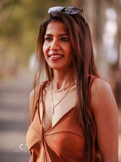 A joyful, candid smile captured in beautiful natural light. This portrait feels warm, genuine, and full of life.