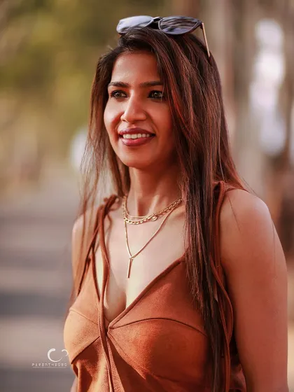 A joyful, candid smile captured in beautiful natural light. This portrait feels warm, genuine, and full of life.