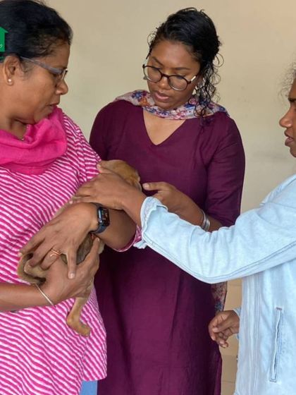 Our team and volunteers helping participants interact with the puppies during the reading session in Coimbatore.