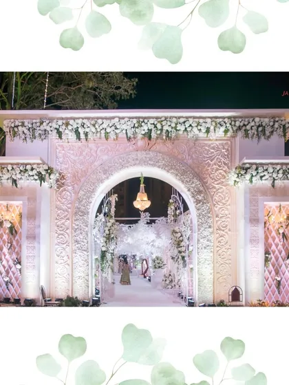 The grand entrance facade, intricately carved and adorned with white florals. This structure is designed to be a statement piece, setting a tone of luxury and elegance from the start.