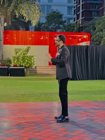 A shot of me hosting the outdoor segment of the Zydus Family Day. Whether indoors or outdoors, I adapt my hosting style to the environment to ensure clear communication and continuous engagement with the crowd.