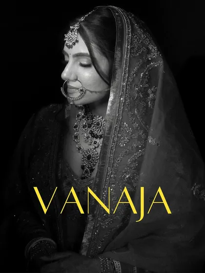 A dramatic black and white portrait of Vanaja, her face in soft focus, creating a timeless and artistic bridal shot.