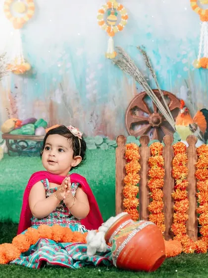 We can create custom themes to celebrate your family's heritage and special occasions. This vibrant studio setup was designed for a Lohri-themed photoshoot, complete with traditional props and colors to honor the festival.
