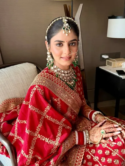 A closer look at Anmol's traditional bridal makeup. The focus is on clean, radiant skin and soft matte eyes, allowing her natural beauty and stunning Sabyasachi outfit to shine.