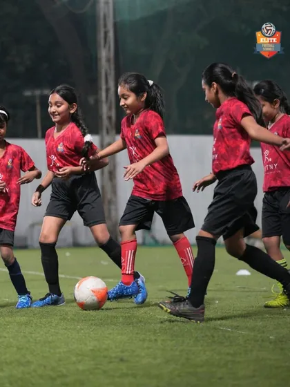 Our girls' team in action during a competitive match. We are committed to providing a platform for female athletes to shine in the football tournaments we organize.