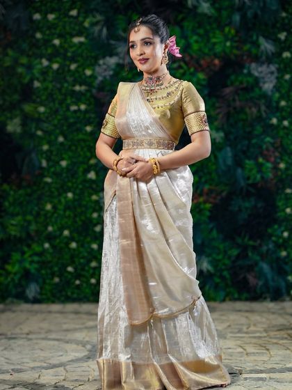 A stunning full-length portrait against a green backdrop.