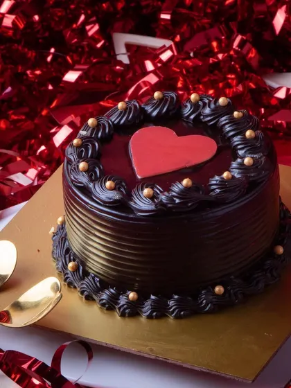 The XOXO Mini Cake is a small but decadent chocolate truffle cake, perfect for an intimate Valentine's celebration for two.