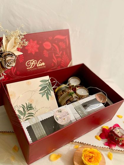 An open view of our largest Diwali hamper, showcasing the generous assortment of truffle boxes, brownies, Regal Riches, and dessert jars.