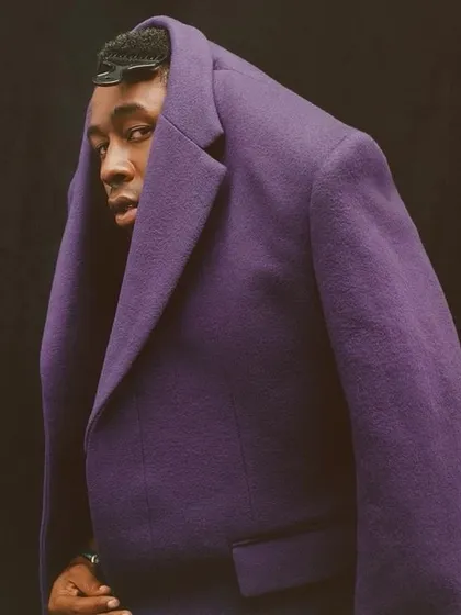 This is an example of my avant-garde and conceptual work. The unconventional styling of this purple tweed coat challenges traditional menswear norms, positioning it as a piece of wearable art and showcasing my creative direction in trend-setting fashion.