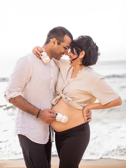 Tiny shoes for tiny feet. Using simple props like baby shoes adds a sweet and personal touch to your couple portraits, symbolizing the little one you're eagerly waiting for.