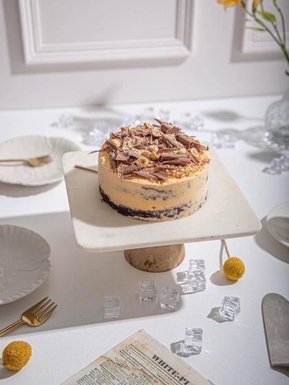 Another angle of our Mango and Chocolate ice cream cake, highlighting its rich texture and delicious toppings.